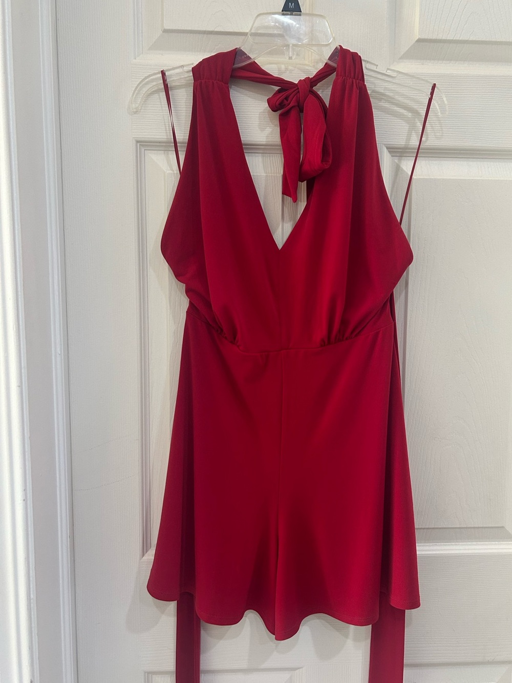 Express Red halter romper with open back. SMALL